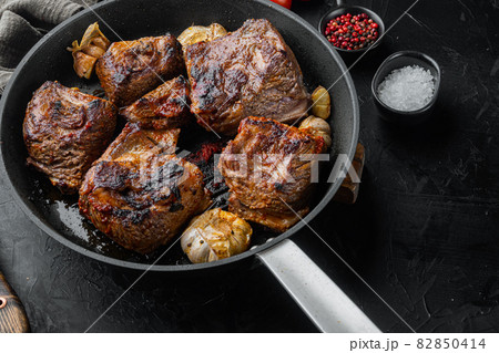 Homemade Braised Beef Short Ribs, on black stone background 82850414