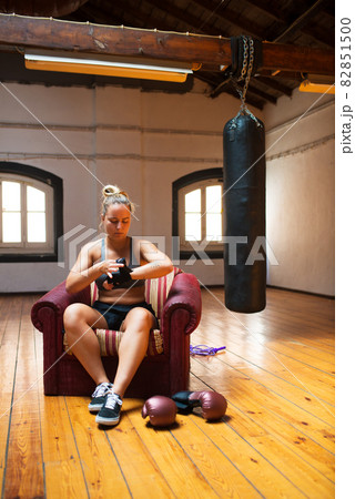 Focused young woman applying wrist wrap Focused young woman applying wrist wrap 82851500