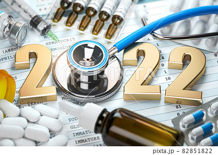2022 Happy New Year. Health care, medicine and pharmacy concept.  Number 2022 with stethoscope and meds. 82851822