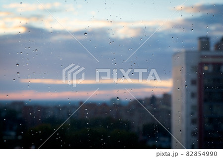 A raindrops on glass on the city background A raindrops on glass on the city background 82854990