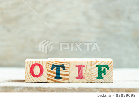 Alphabet letter block in word OTIF (abbreviation of On Time In Full) on wood background Alphabet letter block in word OTIF (abbreviation of On Time In Full) on wood background 82859098
