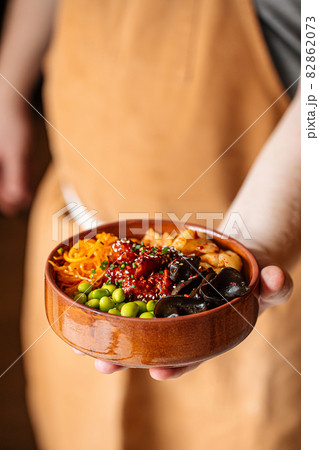 Hawaiian spicy chicken poke bowl with kimchi 82862073