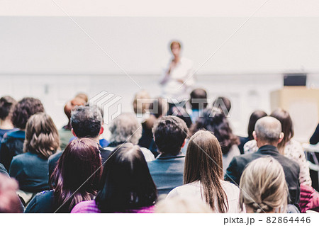 Woman giving presentation on business conference event. 82864446