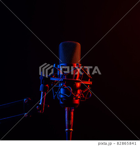 Professional microphone in pink smoke on a black background. 82865841