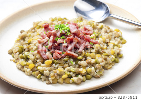 porridge of legumes with fried bacon and chive 82875911