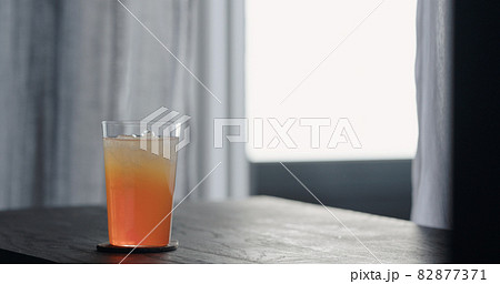 lemonade with crushed ice in tumbler glass on oak table lemonade with crushed ice in tumbler glass on oak table 82877371