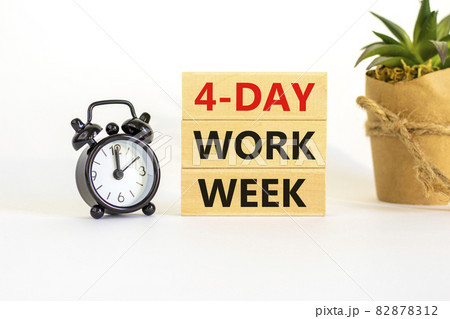 4-day work week symbol. Concept words '4-day work week' on wooden blocks. Black alarm clock, house plant. Beautiful white background. Copy space. Business and 4-day work week concept. 4-day work week symbol. Concept words '4-day work week' on wooden blocks. Black alarm clock, house plant. Beautiful white background. Copy space. Business and 4-day work week concept. 82878312
