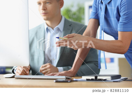 Young man communicates with colleague and is studying business strategies on computer closeup 82881110