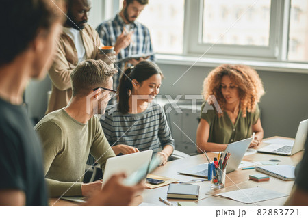 Young colleagues working together on some work tasks 82883721