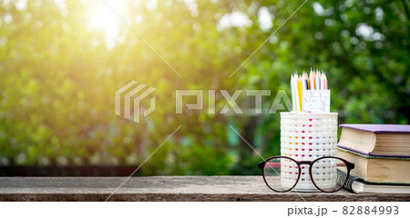 Back to school background with books, pencil and ruler on green blurred backgrounds with copy space. Back to school background with books, pencil and ruler on green blurred backgrounds with copy space. 82884993
