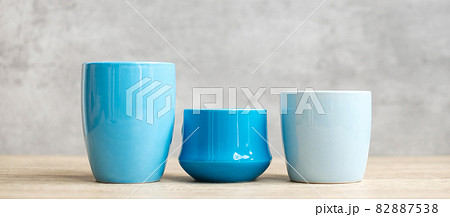 Blue coffee cup and tea mug on wood table background in the morning, Blank copy space for text. International coffee day and daily routine concept 82887538