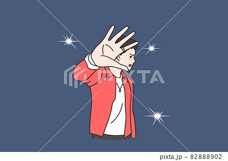 Unhappy man celebrity annoyed by photographer camera flashes 82888902
