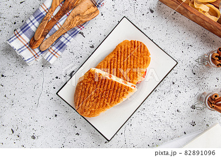 Fresh grilled panini caesar on light background Fresh grilled panini caesar on light background 82891096