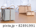 Christmas gifts in craft style on background of bokeh of lights 82891991