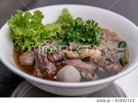 Thai beef clear soup white rice noodle vermicelli with braised beef, meatball and vegetable. Thai beef clear soup white rice noodle vermicelli with braised beef, meatball and vegetable. 82892229