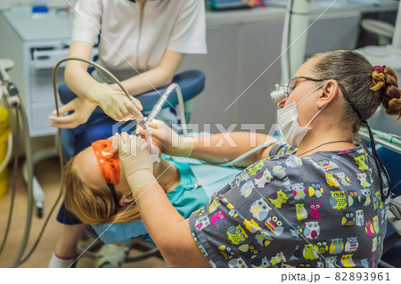 Woman having teeth examined at dentists. Dental treatment in dentistry. Appointment at the dentist. lifestyle, real life Woman having teeth examined at dentists. Dental treatment in dentistry. Appointment at the dentist. lifestyle, real life 82893961