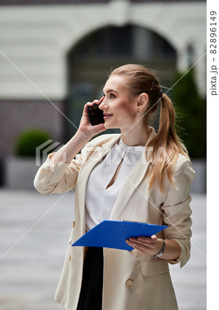 beautiful business woman talking on the phone beautiful business woman talking on the phone 82896149