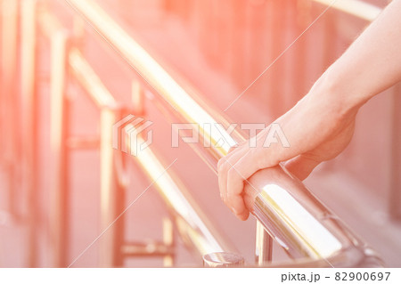 Hand using handrail for wheelchair. Man support Hand using handrail for wheelchair. Man support 82900697