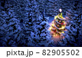 lightened christmas tree surrounded by snow-covered pine trees at night 82905502