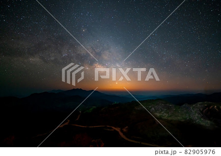 Panorama view universe space shot of milky way galaxy with stars on night sky background at mountains landscape Thailand 82905976
