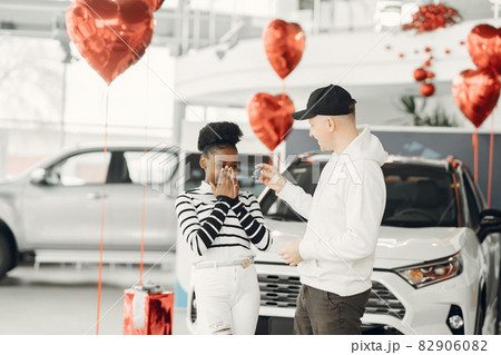 Young african american woman in car salon Young african american woman in car salon 82906082