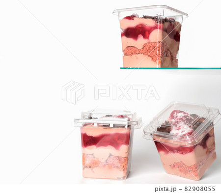 take away trifle cake in a box. chocolate sponge bisquit with mascarpone and cherry berry jam filling. coconut and grated chocolate topping. autumn season sweet treats, copy space 82908055