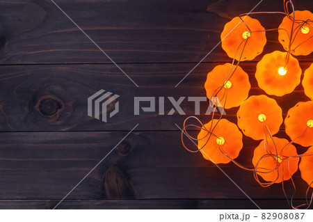 Halloween background, Pumpkin String Lights On Wooden Table Halloween background, Pumpkin String Lights On Wooden Table 82908087