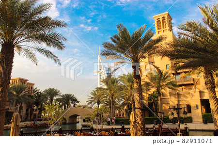Beautiful view on street in Dubai, United Arab Emirates. Palm tree, blue sky. 82911071