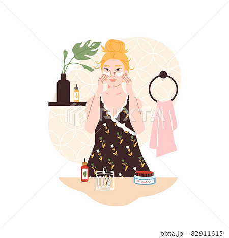 Woman with eye patches skin care mask at the bathroom 82911615