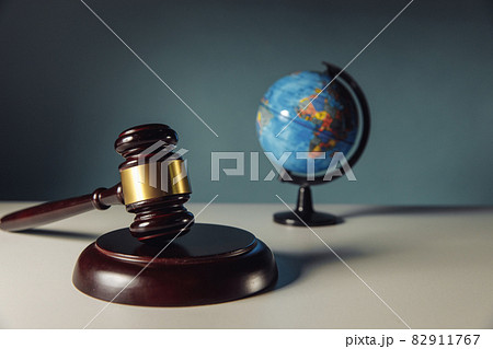 Concept of world justice. Wooden judge gavel and globe 82911767