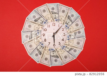 Concept of clock and dollar. Clock on mandala kaleidoscope from money. Abstract money background raster pattern repeat mandala circle. 82912056