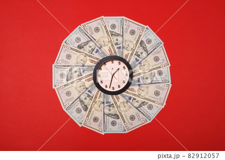 Concept of clock and dollar. Clock on mandala kaleidoscope from money. Abstract money background raster pattern repeat mandala circle. 82912057