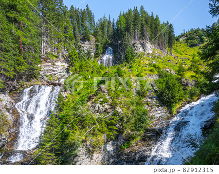 Two waterfalls in Austrian Alps. Tauernbach and Dichtenbach waterfalls confluence. Hohe Tauern National Park, Austria Two waterfalls in Austrian Alps. Tauernbach and Dichtenbach waterfalls confluence. Hohe Tauern National Park, Austria 82912315