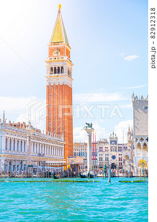 Venice historical center waterfront with St Mark Campanile, Italian: Campanile di San Marco. Sunny summer day in Venice, Italy. Venice historical center waterfront with St Mark Campanile, Italian: Campanile di San Marco. Sunny summer day in Venice, Italy. 82912318