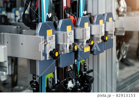 Many ski snowboard storage locker coin cells at peak entrance of station of cabin gondola ski lift at mountain alpine luxury austrian winter resort. Comfort service and facilities for tourists skiers 82913153