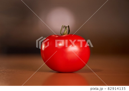 Tomato closeup on a kitchen counter Tomato closeup on a kitchen counter 82914135