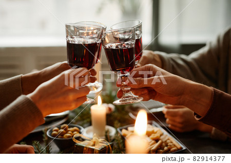 Friends Enjoying Christmas Dinner Close Up 82914377