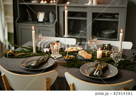 Dining Table lit by Candles on Christmas 82914381