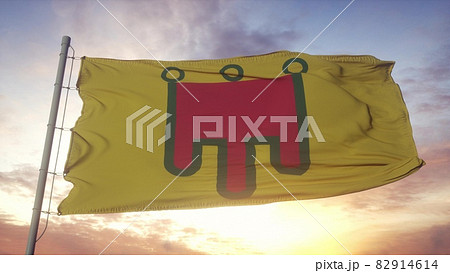 Auvergne flag, France, waving in the wind, sky and sun background. 3d rendering 82914614
