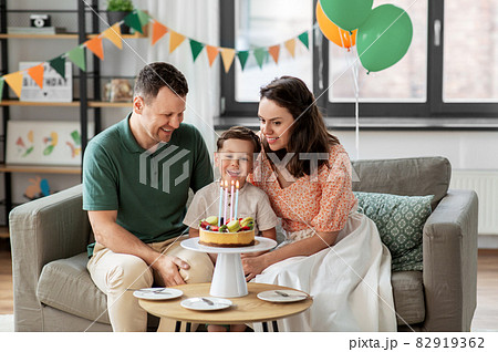 happy family with birthday cake at home happy family with birthday cake at home 82919362