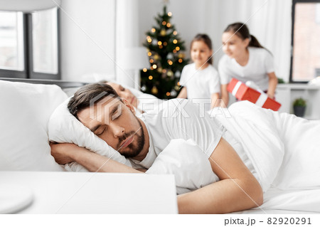 happy children wake their parents on christmas happy children wake their parents on christmas 82920291