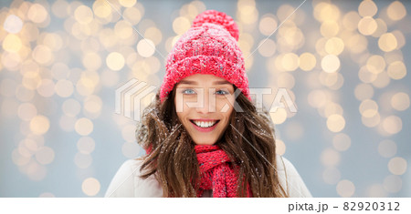 smiling teenage girl outdoors in winter smiling teenage girl outdoors in winter 82920312