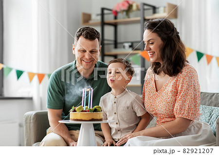 happy family with birthday cake at home happy family with birthday cake at home 82921207