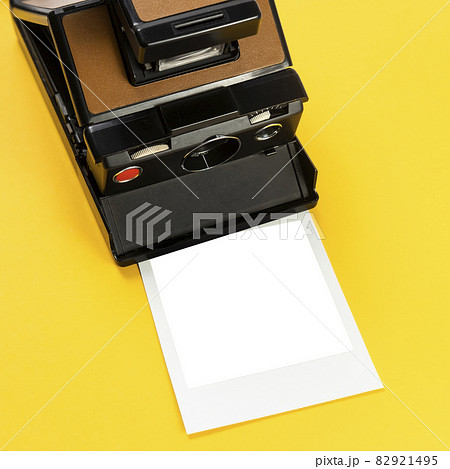 Studio shot of instant camera and blank picture Studio shot of instant camera and blank picture 82921495