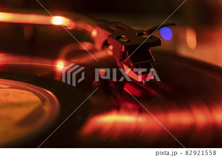 Close-up of a record player needle on record in red light 82921558