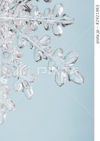 Close-up of snowflake on light blue background 82921963
