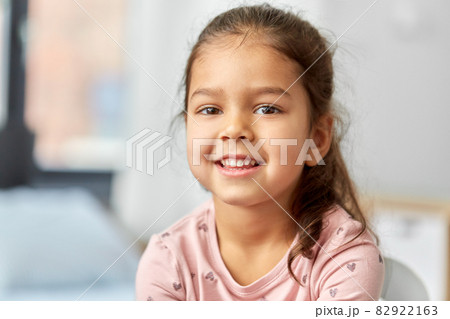 portrait of happy smiling little girl at home portrait of happy smiling little girl at home 82922163
