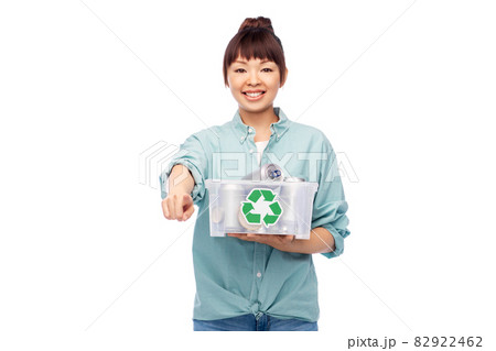 smiling young asian woman sorting metallic waste smiling young asian woman sorting metallic waste 82922462