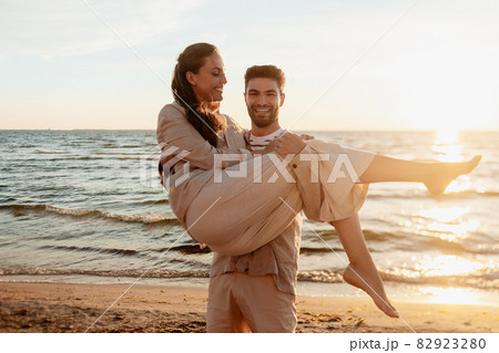 happy couple having fun on summer beach happy couple having fun on summer beach 82923280