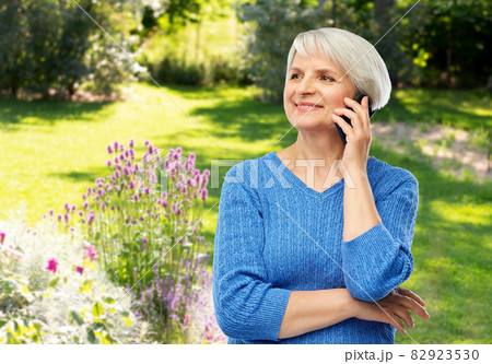smiling senior woman calling on smartphone smiling senior woman calling on smartphone 82923530